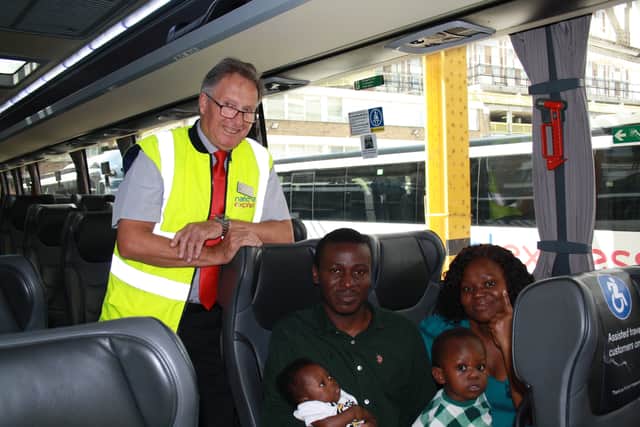 Photo issued by National Express of National Express Driver Tony Boswell (left) with husband and wife Isaiah and Adepeju Opayemi and their newborn son Samuel. Credit: National Express/PA Wire