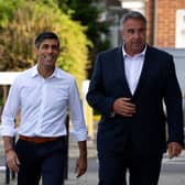 Prime Minister Rishi Sunak (L) visits Uxbridge to congratulate Conservative Party candidate, Steve Tuckwell, (R) after he won the Uxbridge and South Ruislip by-election, on July 21, 2023 in Uxbridge, England. The Conservative Party held the seat of former Prime Minister Boris Johnson with a reduced majority of 495. (Photo by Carl Court - Pool / Getty Images)