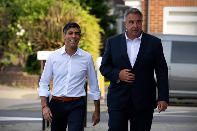 Prime Minister Rishi Sunak (L) visits Uxbridge to congratulate Conservative Party candidate, Steve Tuckwell, (R) after he won the Uxbridge and South Ruislip by-election, on July 21, 2023 in Uxbridge, England. The Conservative Party held the seat of former Prime Minister Boris Johnson with a reduced majority of 495. (Photo by Carl Court - Pool / Getty Images)