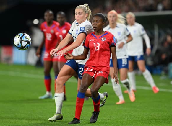 Betina Petit-Frere of Haiti controls the ball against Alessia Russo (Photo by Bradley Kanaris/Getty Images)