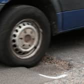 The number of vehicles reported to have been damaged by potholes in the UK has hit a five-year high, according to motoring group RAC. (Credit: Yui Mok/PA Wire)