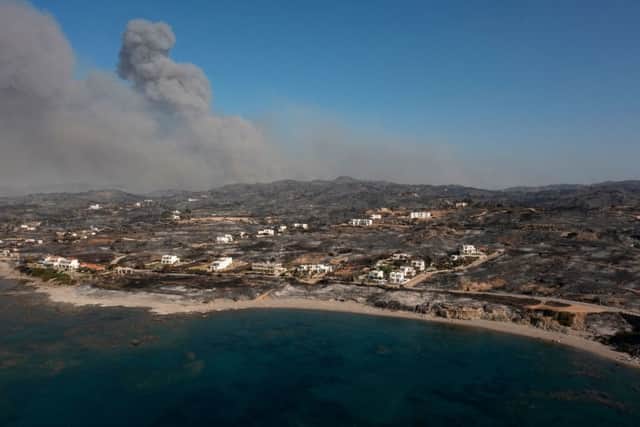 Smoke billowing in the background of Kiotari village on the island of Rhodes (Photo: Getty Images)