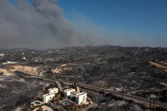 Smoke billowing in background of Kiotari village on the island of Rhodes (Photo: Getty Images)