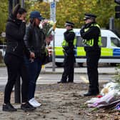 Women lay flowers near the scene of a tram crash on November 10, 2016 in Croydon, England. Seven people were killed in the disaster. Credit: Carl Court/Getty Images