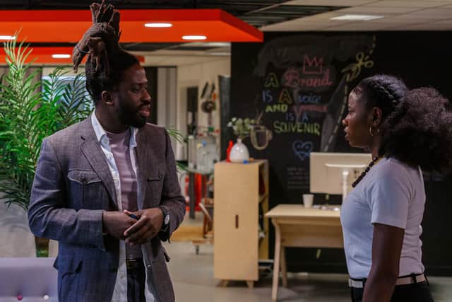 Adjani Salmon as Kwabena and Dani Moseley as Amy in Dreaming Whilst Black, meeting in the production office (Credit: BBC/Big Deal Films/Anup Bhatt)