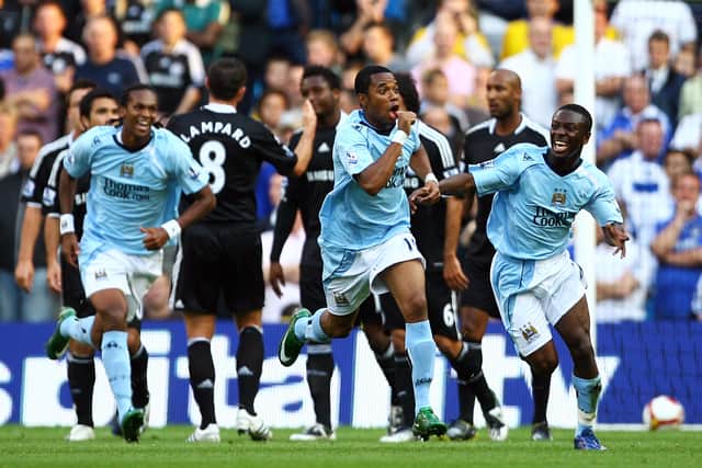 Robinho of Manchester is mobbed celebrates after he scores the first goal of the game during the Barclays Premier League match between Manchester City and Chelsea at The City of Manchester Stadium on September 13, 2008 (Photo by Alex Livesey/Getty Images)