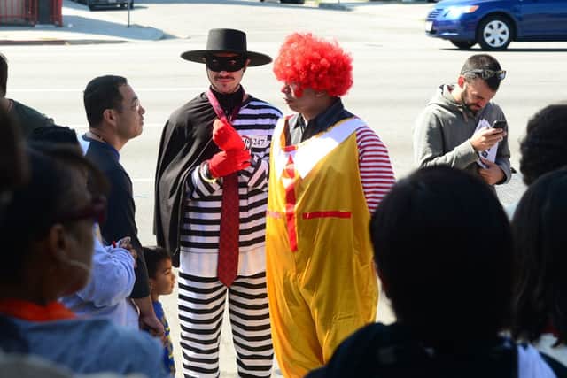Two men in costume as The Hamburglar and Ronald McDonald (Getty)