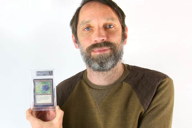 Auctioneer Andrew Ewbank with the rare The Black Lotus card from the Magie The Gathering trading card game. The ‘Holy Grail’ item is expected to fetch up to £50,000 when it goes under the hammer on July 28.