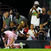 Lionel Messi #10 of Inter Miami CF prepares to enter as WTA player Serena Williams and NBA player LeBron James of the Los Angeles Lakers take photos as celebrity Kim Kardashian looks on prior to Messi entering the match during the Leagues Cup 2023 match between Cruz Azul and Inter Miami CF  at DRV PNK Stadium on July 21, 2023 in Fort Lauderdale, Florida. (Photo by Mike Ehrmann/Getty Images)