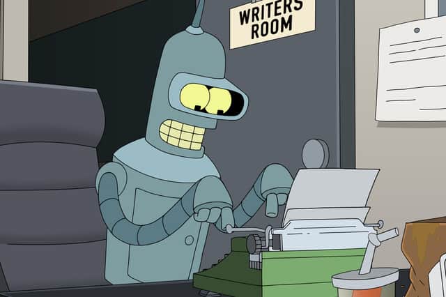 John DiMaggio as Bender in Futurama S11, typing on a typewriter in a small office with a WRITERS ROOM sign affixed on the door (Credit: Hulu)