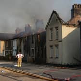 Emergency services fight fires in a row of houses in July 2022 in Wennington, after a series of grass fires broke out around the capital during an intense heatwave (Photo by Carl Court/Getty Images)