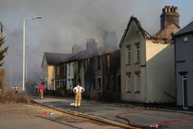 Emergency services fight fires in a row of houses in July 2022 in Wennington, after a series of grass fires broke out around the capital during an intense heatwave (Photo by Carl Court/Getty Images)
