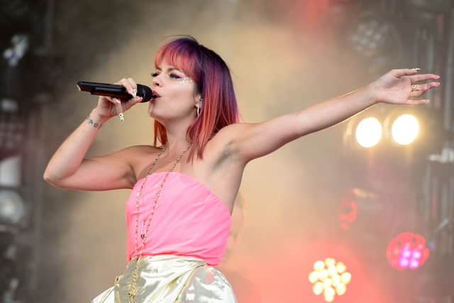 British singer Lily Allen performs on the Pyramid Stage, on the first official day of the Glastonbury Festival of Music and Performing Arts in Somerset, southwest England, on June 27, 2014. US metal giants Metallica will play this year's coveted Saturday night headline spot at Britain's Glastonbury festival, organisers announced Thursday. It will be the "Master of Puppets" four-piece's first appearance at the legendary festival, held in south west England, following on from The Rolling Stones' Worthy Farm debut last year. AFP PHOTO / LEON NEAL / AFP PHOTO / LEON NEAL        (Photo credit should read LEON NEAL/AFP via Getty Images)
