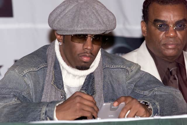 Sean "P. Diddy" Combs on his two-way pager (Scott Gries/ImageDirect)