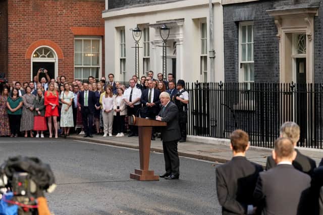 Charlotte Owen (red dress) watches on as Boris Johnson gives his resignation speech outside Number 10. Credit: Getty