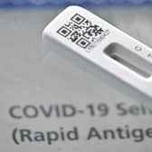 A picture taken on February 20, 2022 shows a Covid-19 Lateral Flow (LFT) self-test kit, containing a SARS-CoV-2 Antigen Rapid Test, arranged for a photograph, in London (Picture: JUSTIN TALLIS/AFP via Getty Images)