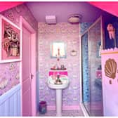 A couple have transformed their home into a pink paradise which includes a mermaid bathroom. Photo by SWNS.