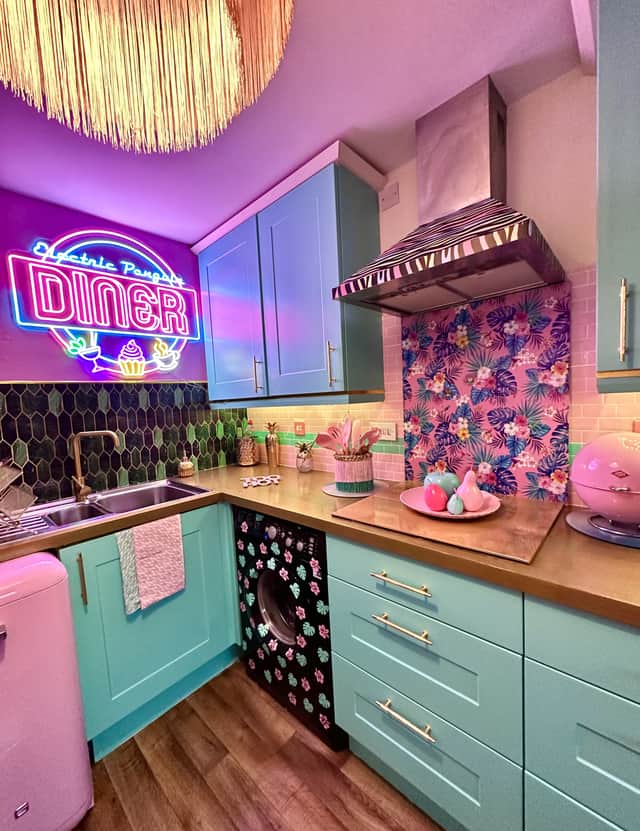 The mint green and pastel pink kitchen. Photo by SWNS.