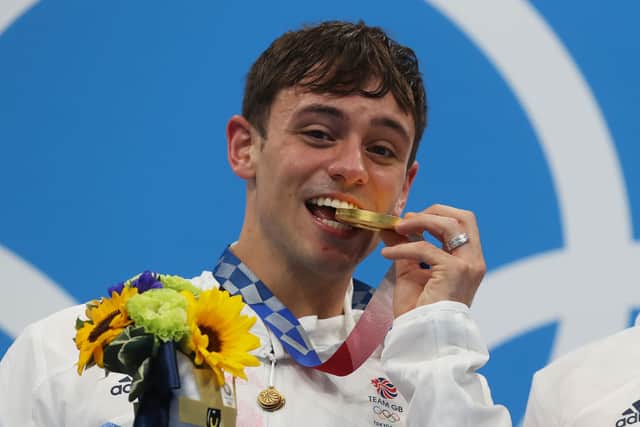 Tom Daley celebrates with his gold medal in Tokyo 2020