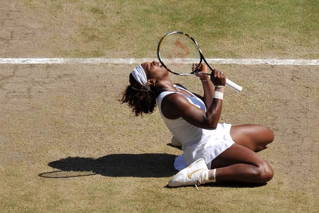 Serena Williams celebrates after beating her sister Venus 7-6, 6-2, during their Women's Singles Final of the 2009 Wimbledon Tennis Championships, on July 4, 2009. (CARL DE SOUZA/AFP via Getty Images)