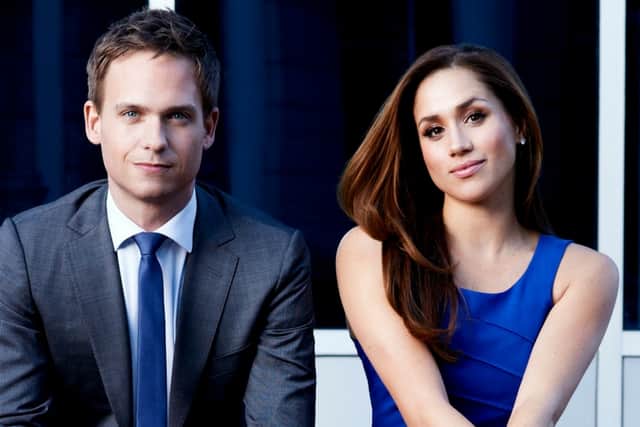 (L-R) Patrick J. Adams and Meghan Markle in a promotional still for USA Network's "Suits" (Credit: USA Network)