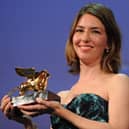 US film director Sofia Coppola holds the Golden Lion she received for his film "Somewhere" during the awards ceremony of the 67th Venice film festival on September 11, 2010.  (Credit: ALBERTO PIZZOLI/AFP via Getty Images)