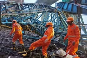 India's National Disaster Response Force inspects the site of an under-construction Samruddhi Expressway where a crane collapsed on a slab of the bridge in Thane district of India's Maharashtra state. (Photo: India's National Disaster Response Force)