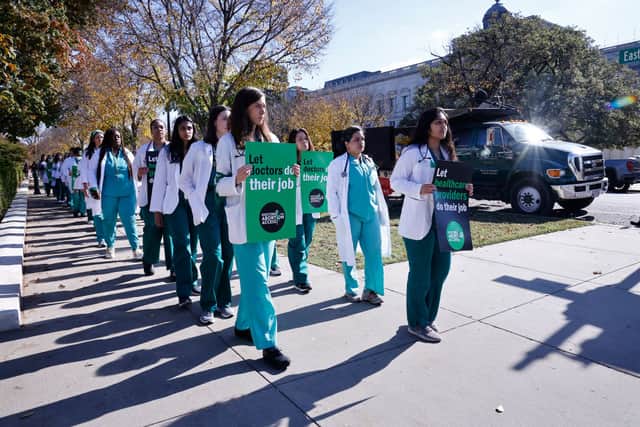Doctors from across the US march to the Capitol to demand an end to the current and future criminalisation of providers who perform abortion care on 3 November, 2022 in Washington, DC. Credit: Photo by Paul Morigi/Getty Images for Doctors for Abortion Action