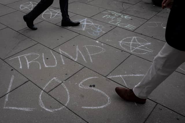 Messages written in chalk outside the courthouse in Washington DC ahead of Trump’s arraignment (Photo: Drew Angerer/Getty Images)