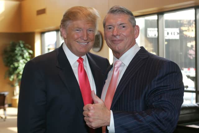 Vince McMahon (L) and Donald Trump attend a press conference about the WWE at the Austin Straubel International Airport on June 22, 2009 in Green Bay, Wisconsin. (Photo by Mark A. Wallenfang/Getty Images)