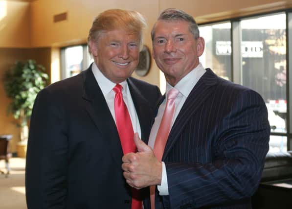 Vince McMahon (L) and Donald Trump attend a press conference about the WWE at the Austin Straubel International Airport on June 22, 2009 in Green Bay, Wisconsin.  (Photo by Mark A. Wallenfang/Getty Images)