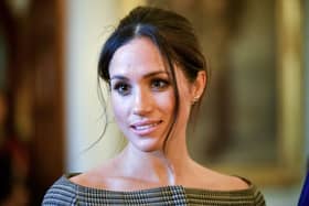 Britain's Prince Harry's fiancÃ©e US actress Meghan Markle chats with people inside the Drawing Room during a visit at Cardiff Castle in Cardiff, south Wales on January 18, 2018, for a day showcasing the rich culture and heritage of Wales. / AFP PHOTO / POOL / Ben Birchall        (Photo credit should read BEN BIRCHALL/AFP via Getty Images)