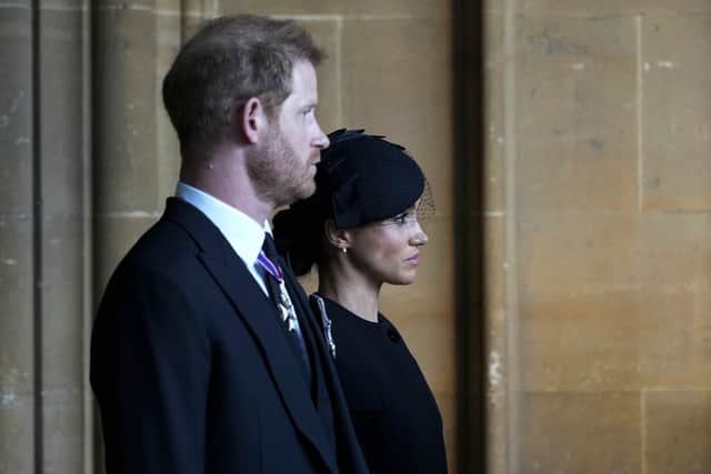Prince Harry, Duke of Sussex, and Meghan, Duchess of Sussex leave after escorting the coffin of Queen Elizabeth II to Westminster Hall from Buckingham Palace for her lying in state, on September 14, 2022 in London, United Kingdom. (Photo by Emilio Morenatti - WPA Pool/Getty Images)