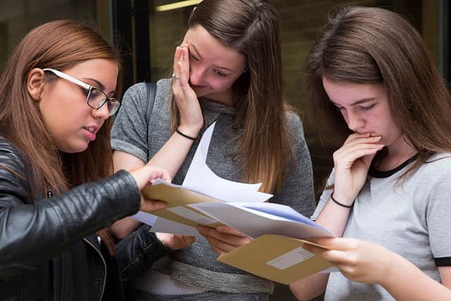 Pupils receive their GCSE results at Stoke Newington School on 20 August, 2015 in London, United Kingdom. GCSE grades from A* to C rose slightly this year with A* and A grades falling.  (Photo by Dan Kitwood/Getty Images)