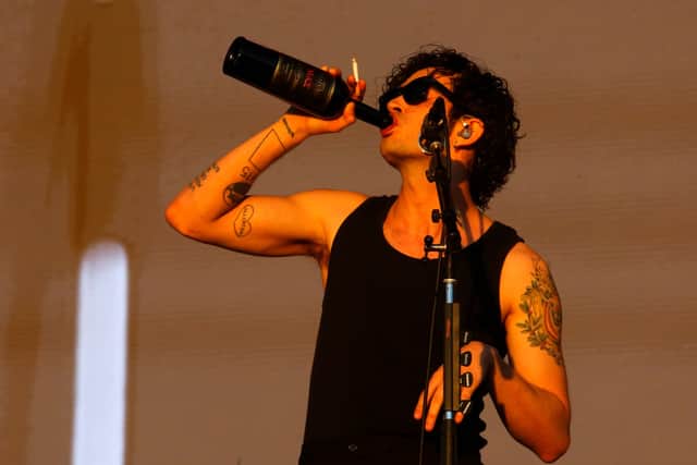 In a video posted to social media last month, Healy said he was going to “pull out” of the event because he didn’t “see the point of inviting The 1975 to a country and then telling us who we can have sex with.”  (Photo by Marcelo Hernandez/Getty Images)