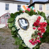 Flowers and tributes are pictured outside the former home of Irish singer Sinead O'Connor, in Bray, eastern Ireland, ahead of her funeral. A funeral service for Sinead O'Connor, the outspoken singer who rose to international fame in the 1990s, is to be held on Tuesday in the Irish seaside town of Bray. (Photo by PAUL FAITH / AFP) (Photo by PAUL FAITH/AFP via Getty Images)