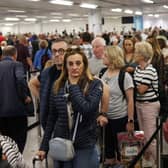 Queuing passengers at Gatwick Airport. (Photo by Dan Kitwood/Getty Images)
