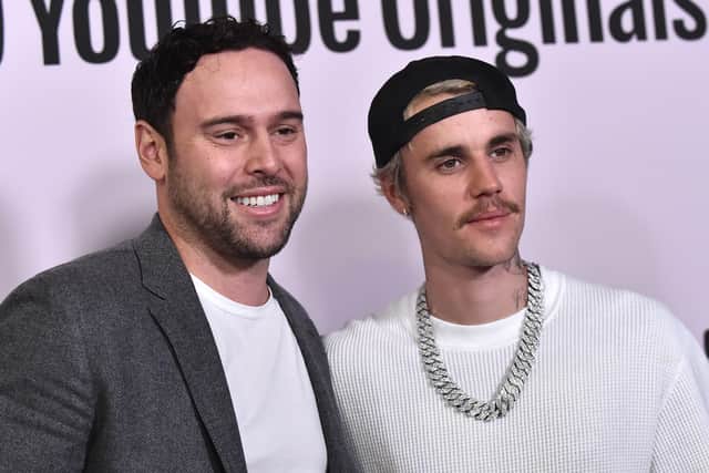 US businessman Scooter Braun (L) and Canadian singer Justin Bieber arrive for YouTube Originals' "Justin Bieber: Seasons" premiere at the Regency Bruin Theatre in Los Angeles on January 27, 2020. (Photo by LISA O'CONNOR / AFP) 