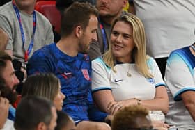OPSHOT - England's forward Harry Kane talks with his wife Katie Goodland after defeating Wales 3-0 in the Qatar 2022 World Cup Group B football match between Wales and England at the Ahmad Bin Ali Stadium in Al-Rayyan, west of Doha on November 29, 2022. (Photo by Paul ELLIS / AFP) (Photo by PAUL ELLIS/AFP via Getty Images)