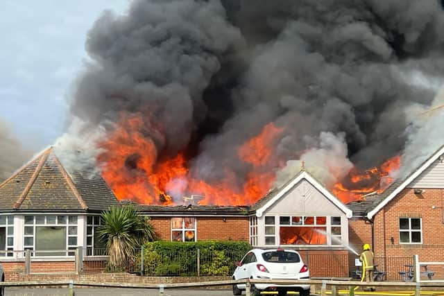 Handout photo by Connor Tombs of firefighters tackling a blaze at a Harvester restaurant in Littlehampton, West Sussex which has produced large plumes of smoke visible for miles around and destroyed the establishment's roof. (Image: PA)