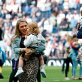 English striker Harry Kane (R) and his partner Katie Goodland (L)  with their two daughters after the English Premier League football match between Tottenham Hotspur and Everton at Tottenham Hotspur Stadium in London, on May 12, 2019. (Photo by Ian KINGTON / AFP) 