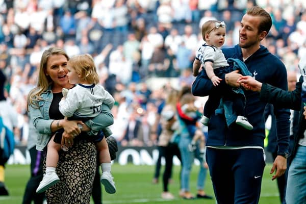 English striker Harry Kane (R) and his partner Katie Goodland (L)  with their two daughters after the English Premier League football match between Tottenham Hotspur and Everton at Tottenham Hotspur Stadium in London, on May 12, 2019. (Photo by Ian KINGTON / AFP) 