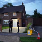 Police officers outside a property on Hammond Road in Woking, Surrey, after a 10-year-old girl was found dead and a murder probe was launched 
Picture: Jonathan Brady/PA Wire