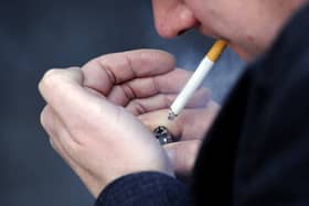 PICTURE POSED BY A MODEL File photo dated 12/03/13 of a man smoking a cigarette. Messages encouraging smokers to quit could be added to the inside of cigarette packs under draft proposals being considered by the Government. Issue date: Monday August 14, 2023.