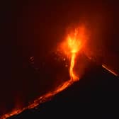 Lava flows from the Mount Etna volcano on the southern Italian island of Sicily, near Catania, late on December 6, 2015.
