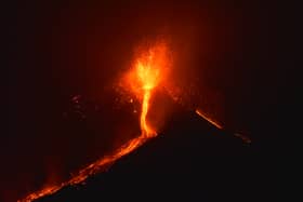 Lava flows from the Mount Etna volcano on the southern Italian island of Sicily, near Catania, late on December 6, 2015.