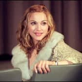 Madonna turns in her chair during the Director's Guild of America screening of her new movie "Evita" for the international  press on the 10 December, 1997