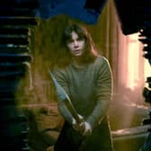 Ruth Wilson as Lorna Brady in The Woman in the Wall, holding an axe (Credit: BBC/Motive Pictures/Chris Barr)
