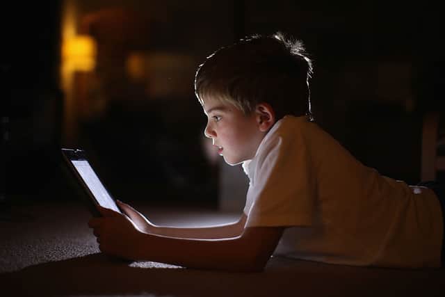 In this photograph illustration a ten-year-old boy uses an Apple IPad tablet computer on November 29, 2011 in Knutsford, United Kingdom. Credit: Christopher Furlong/Getty Images