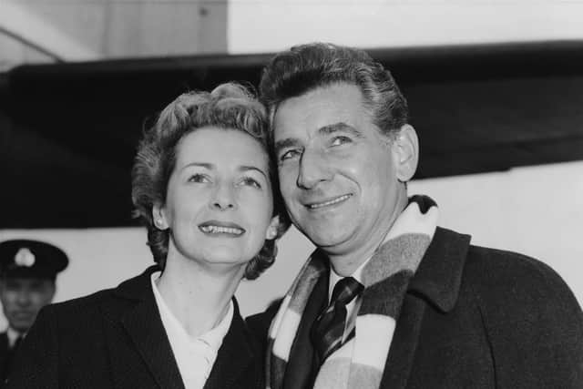 American composer Leonard Bernstein (1918 - 1990) arrives at London Airport with his wife, actress Felicia Montealegre (1922 - 1978), having flown in from Gothenburg in Sweden, 9th October 1959. (Photo by Lee/Central Press/Hulton Archive/Getty Images)